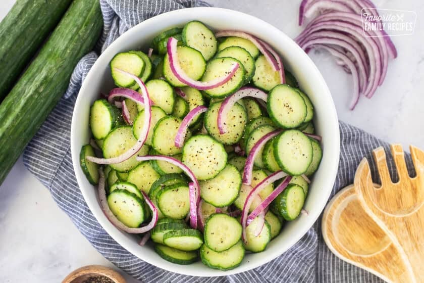 Bowl of cucumber vinegar salad with fresh cracked pepper.