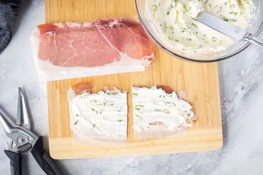 Prosciutto spread with cream cheese mixture on top and cut in half with kitchen scissors.