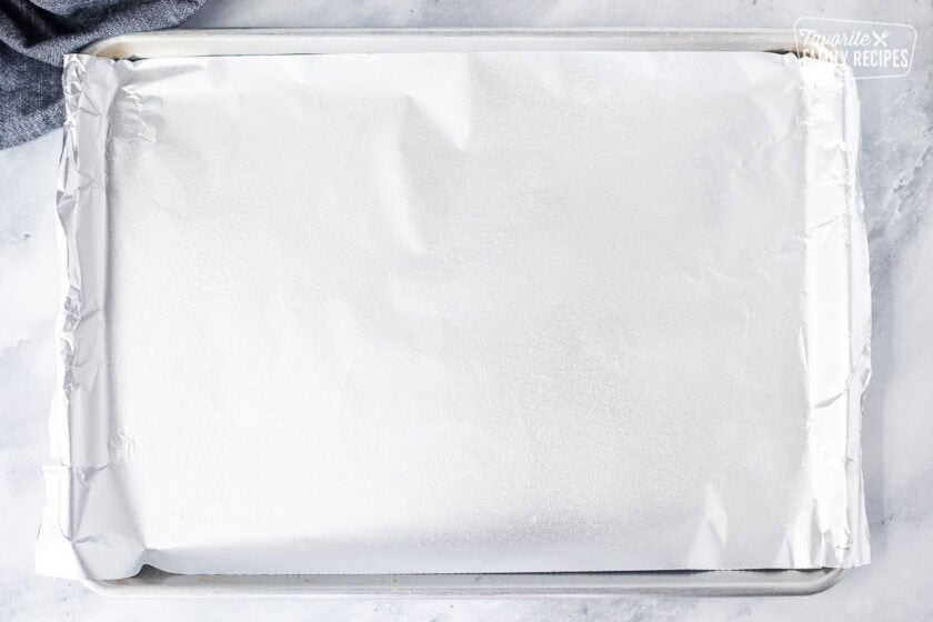 Sheet pan with foil and non stick cooking spray.