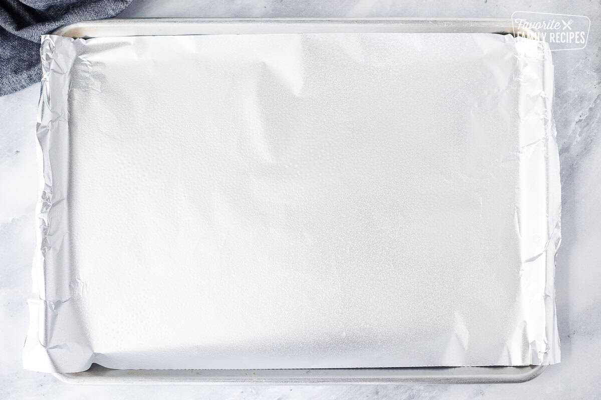 Sheet pan with foil and non stick cooking spray.