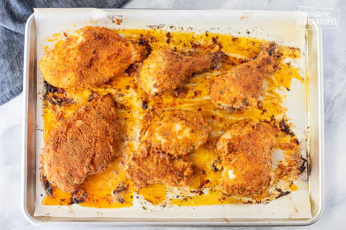 Baked shake and bake chicken on a sheet pan.