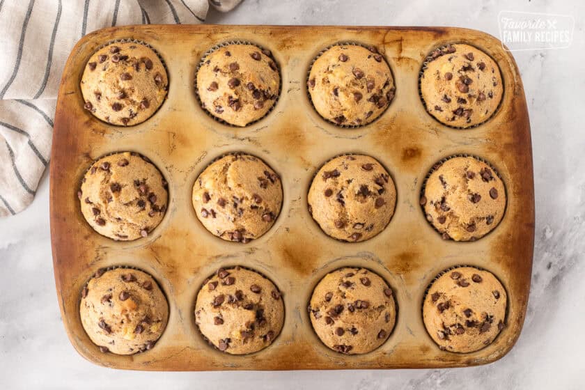 Baked Banana Chocolate chip muffins baked in a muffin pan.