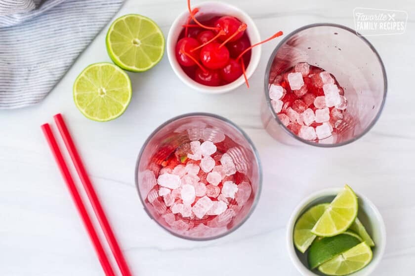 Two glasses with pebble ice added to glasses.