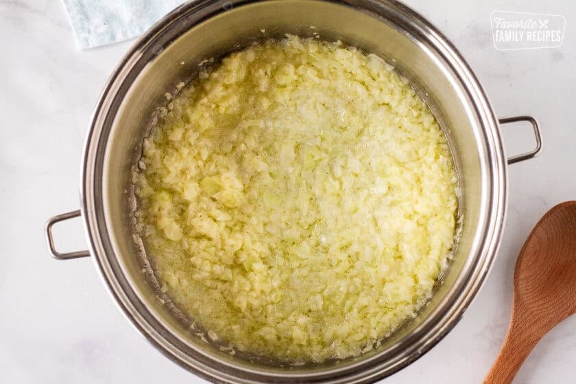 Large pot cooking onions in butter for Corn Chowder with Bacon.