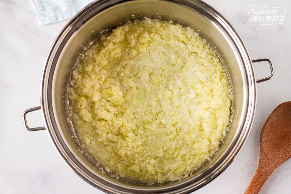 Large pot cooking onions in butter for Corn Chowder with Bacon.