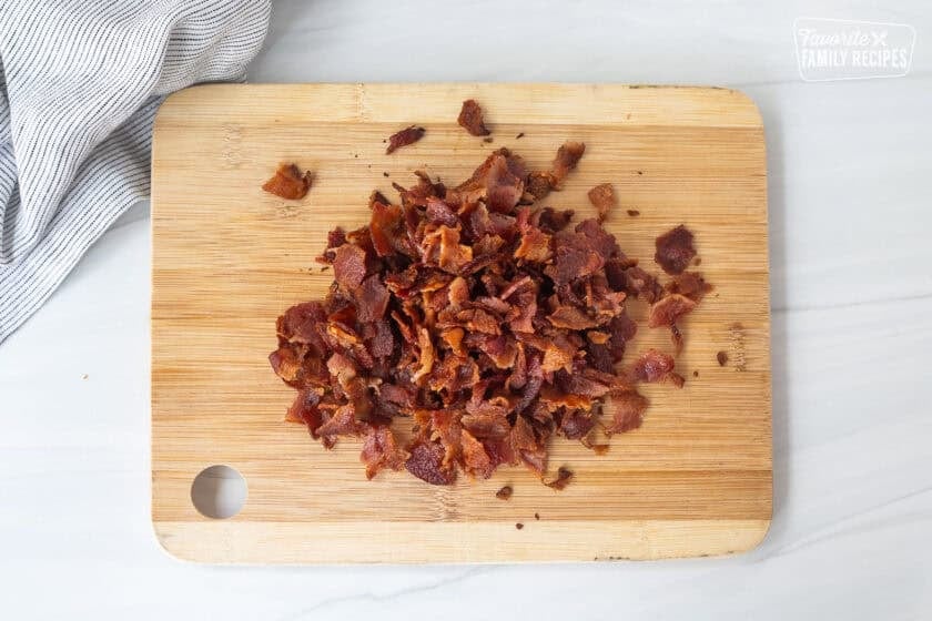 Chopped bacon on a cutting board.