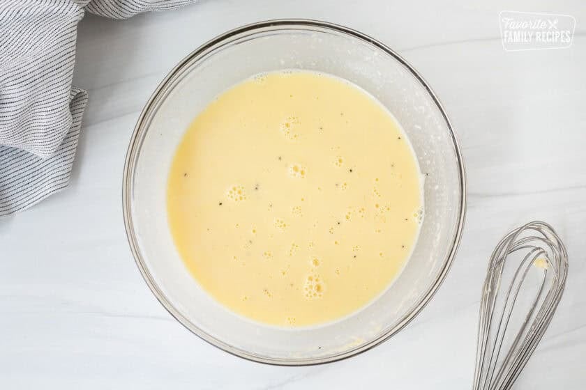 Glass bowl with Parmigiana Reggiano egg and cream combined.
