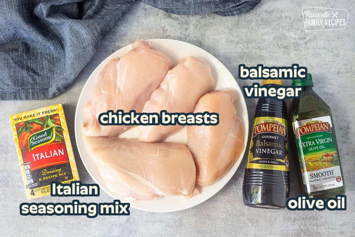 Ingredients to make grilled balsamic chicken including chicken breasts, balsamic vinegar, olive oil and Italian dressing mix.