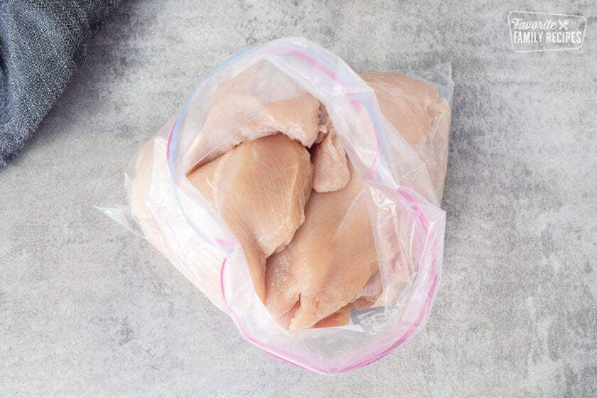 Plastic zip bag with chicken breasts.