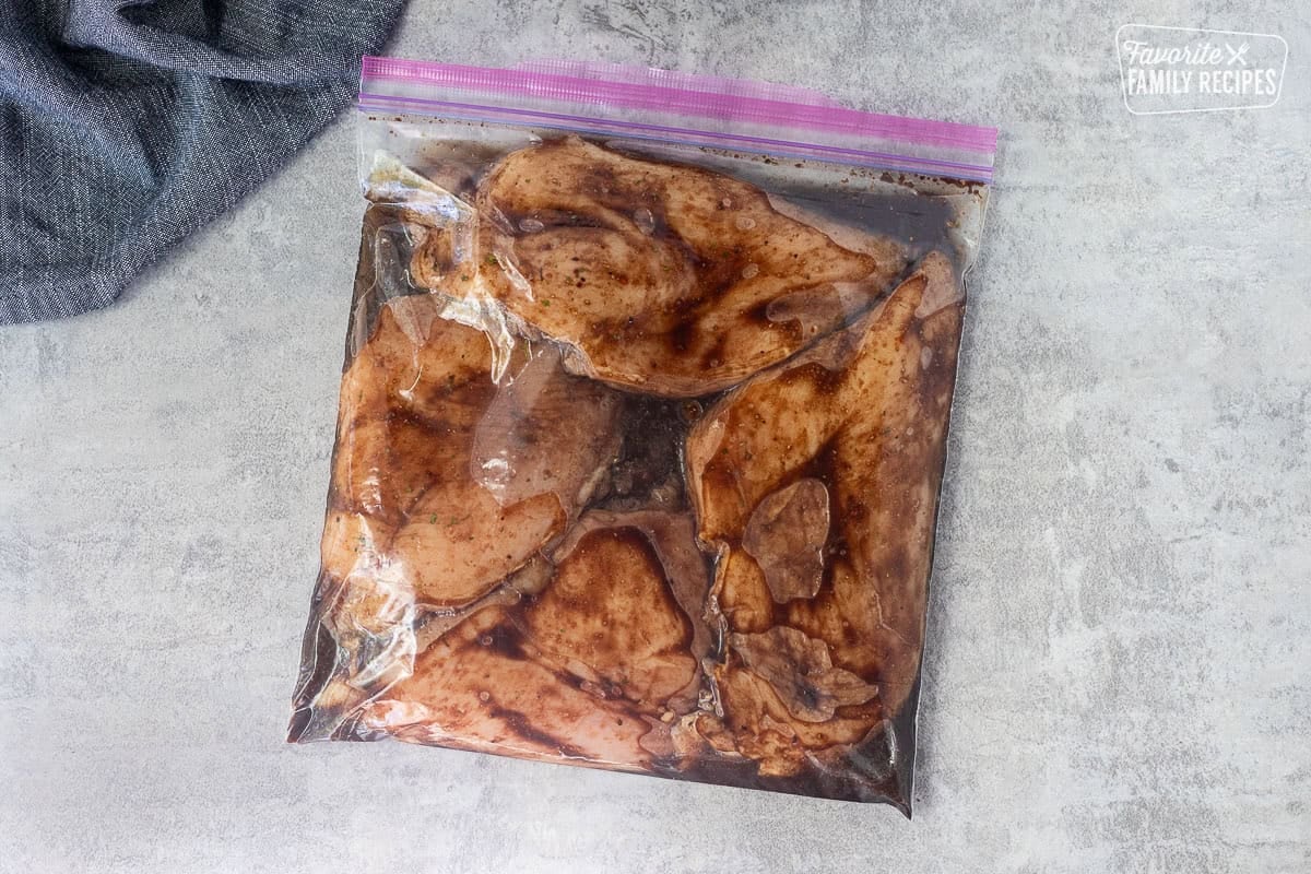 Ziplock bag with marinading chicken breasts.