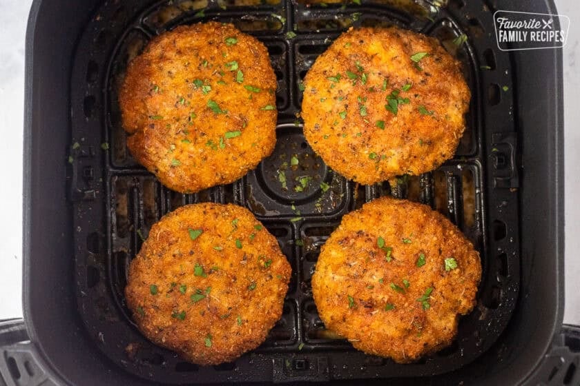 Four ground chicken patties in the air fryer.