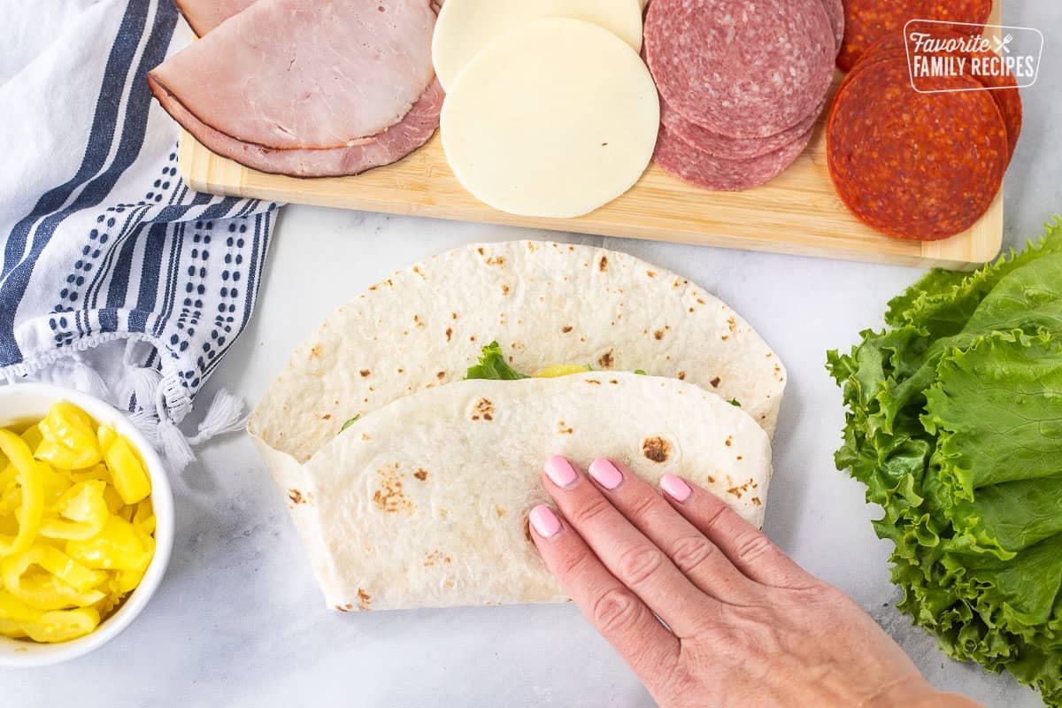 Folding an Italian wrap by hand.