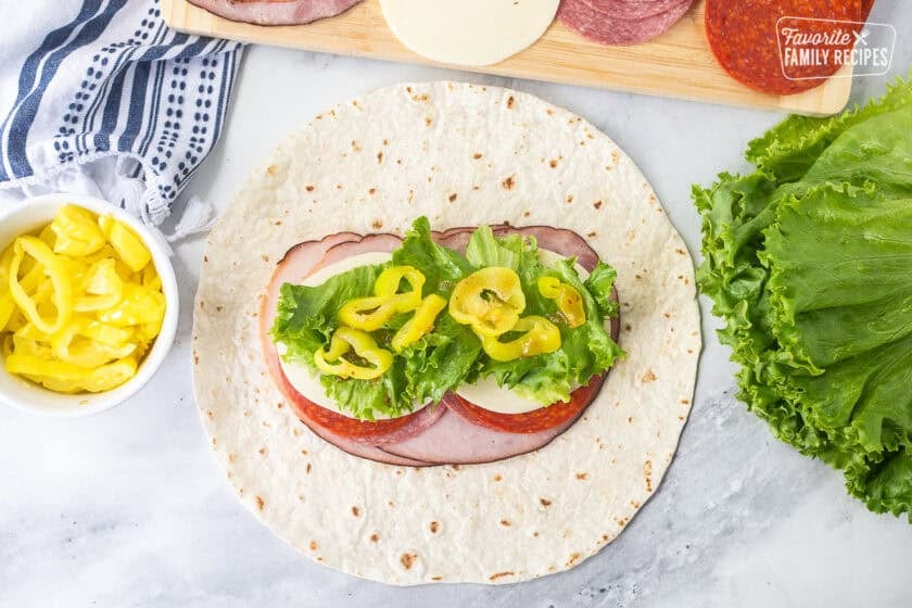 Flour tortilla with ham, salami, pepperoni, provolone cheese, lettuce, banana peppers and zesty Italian dressing.