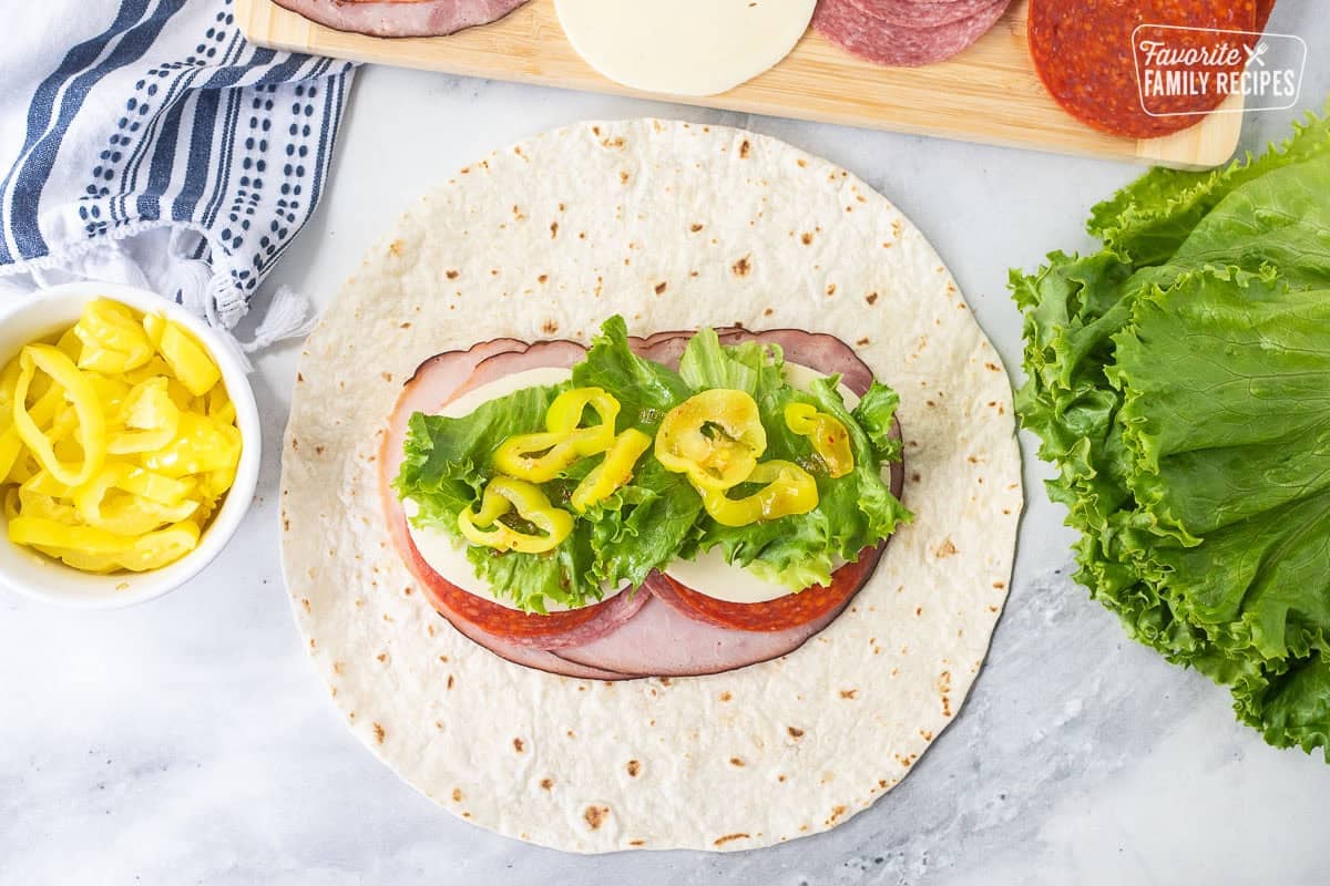 Flour tortilla with ham, salami, pepperoni, provolone cheese, lettuce, banana peppers and zesty Italian dressing.