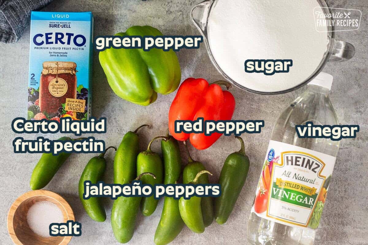 Ingredients to make Jalapeno Pepper Jelly including jalapeños, green bell pepper, red bell pepper, sugar, vinegar, salt and liquid pectin.