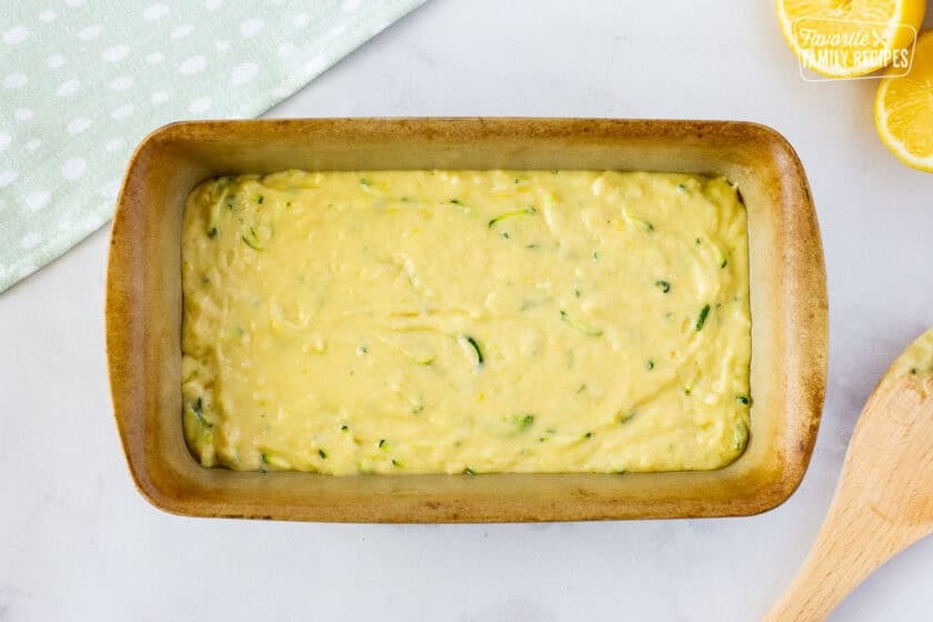 Batter of lemon zucchini bread in a loaf pan.
