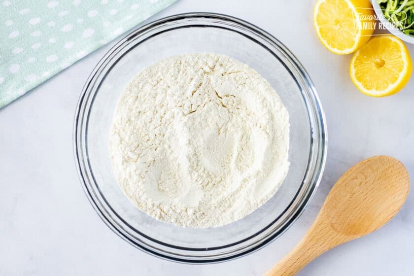 Dry ingredients for lemon zucchini bread blended in a bowl.