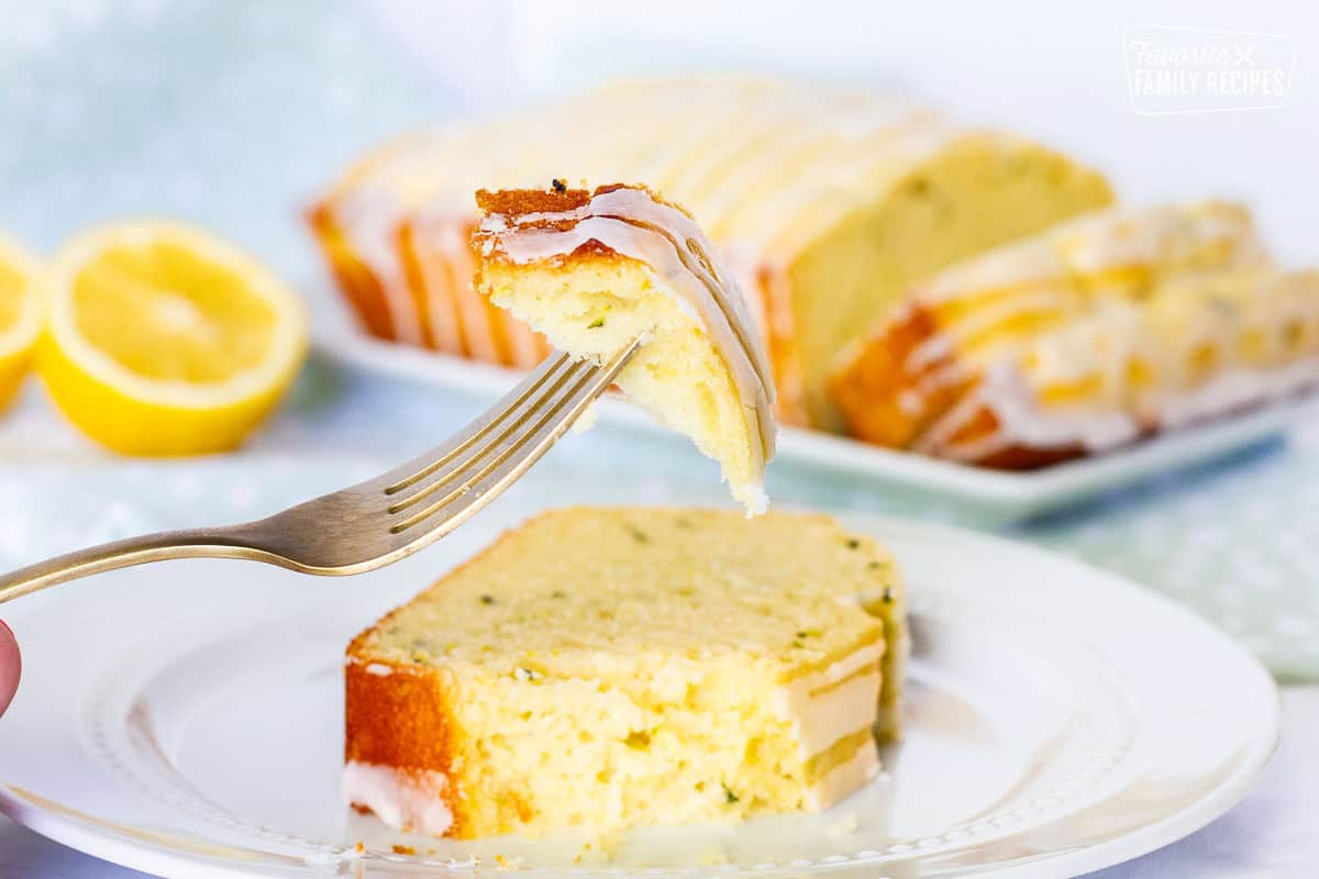 Corner piece of lemon zucchini bread on a fork.
