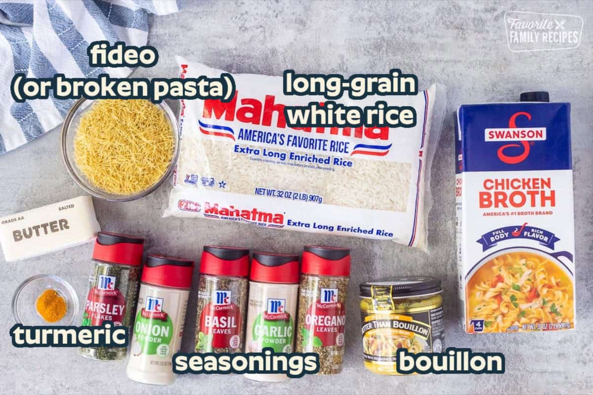 Ingredients to make homemade Rice-A-Roni including long grain rice, chicken broth, chicken bouillon, oregano, garlic powder, basil, onion powder, parsley, turmeric, butter, and vermicelli.