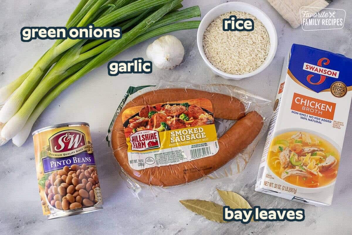 Ingredients in Brazilian Rice and Beans: Rice, Smoked Sausage, Pinto Beans, green onions, garlic, chicken broth