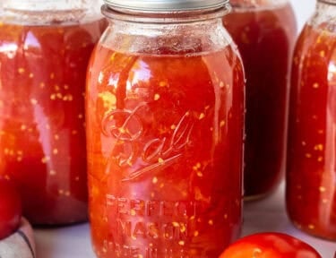 Canned diced tomatoes in jars.