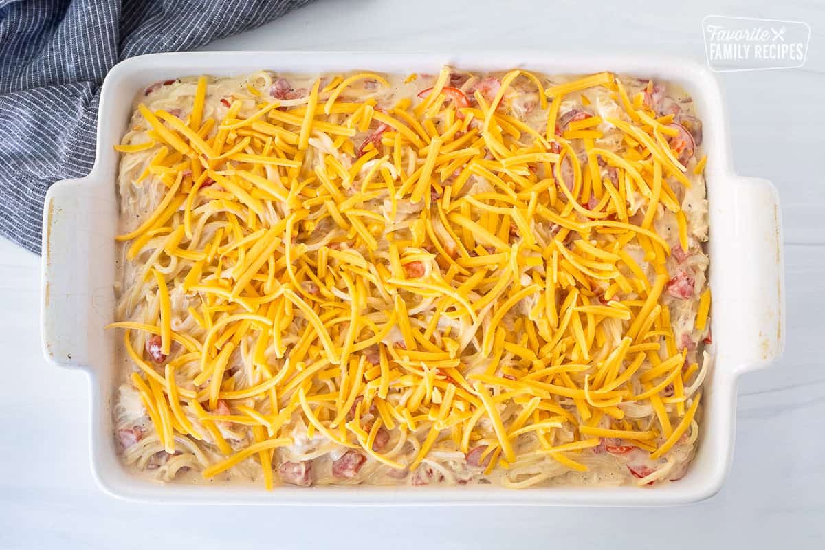 Casserole dish with chicken spaghetti casserole unbaked.