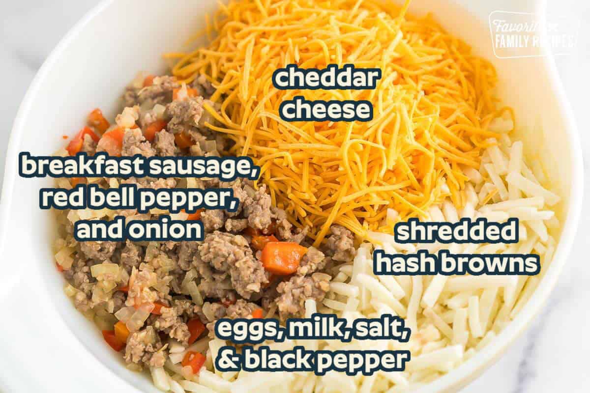 Ingredients to make hash brown breakfast casserole including breakfast sausage, red bell pepper, onion, frozen shredded hash browns, cheddar cheese, eggs, milk, salt, and black pepper.