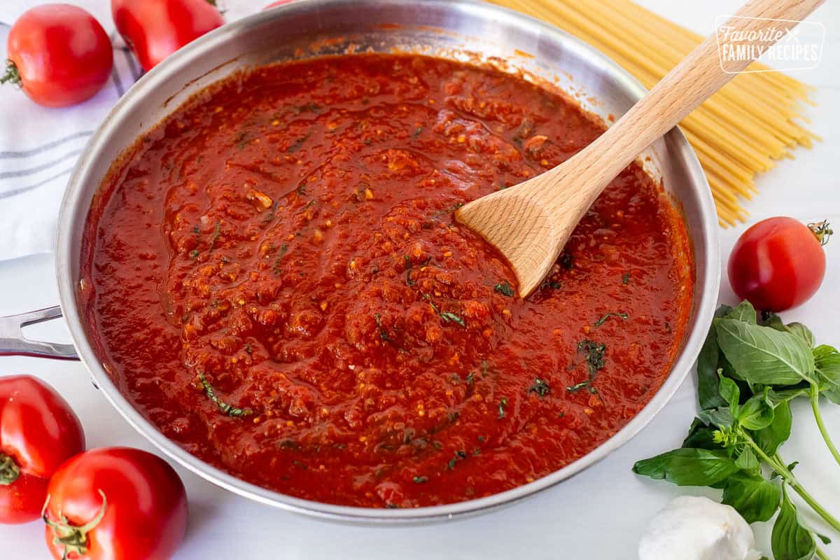 Spaghetti sauce simmering in a skillet