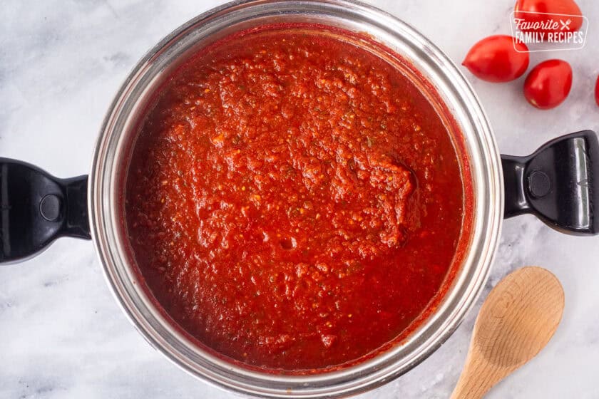 Large stockpot of simmering savory salsa for canning.