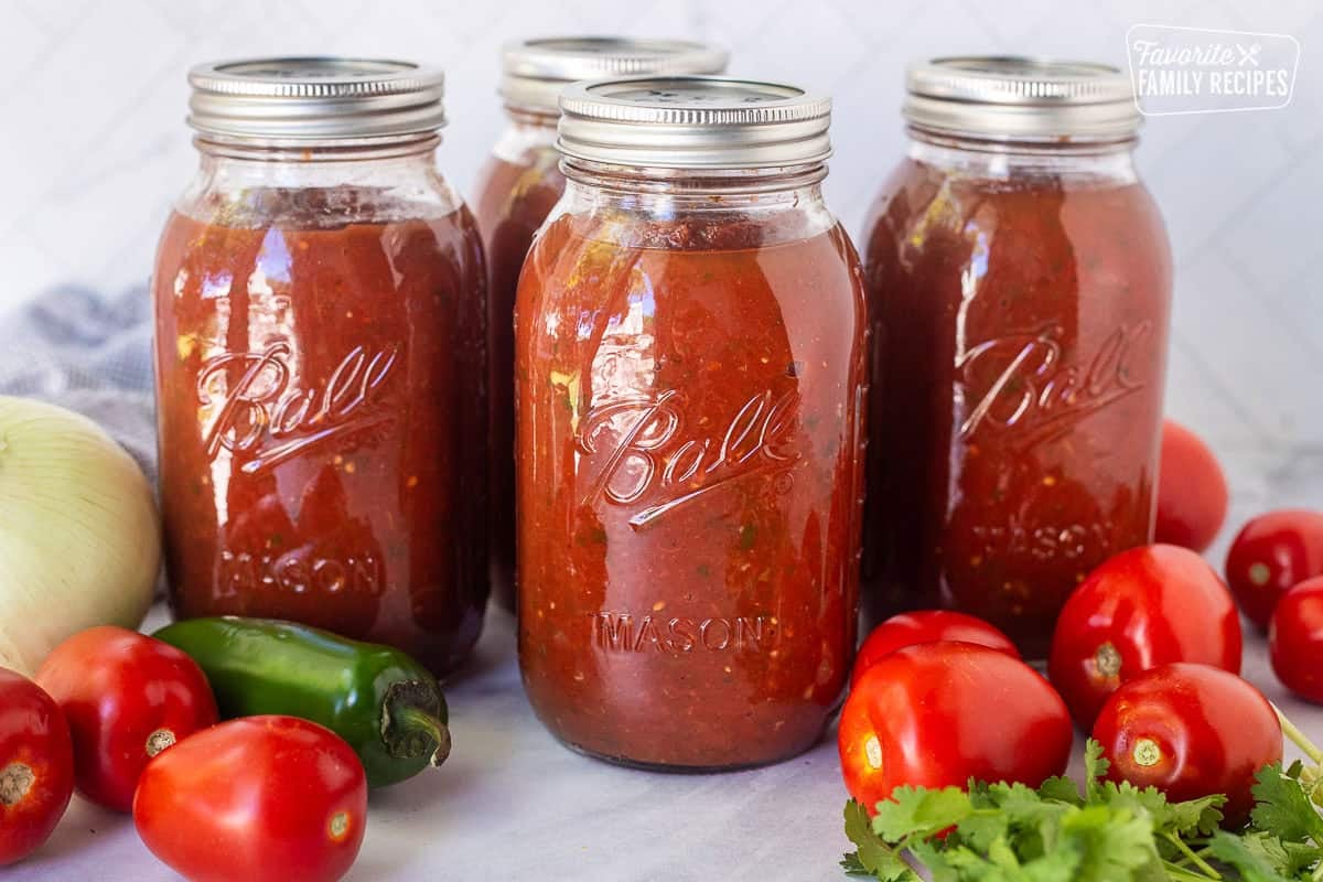 Savory canned salsa in jars.