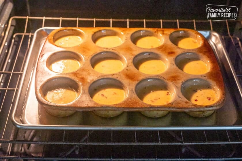 Muffin pan over cookie sheet of water in oven.