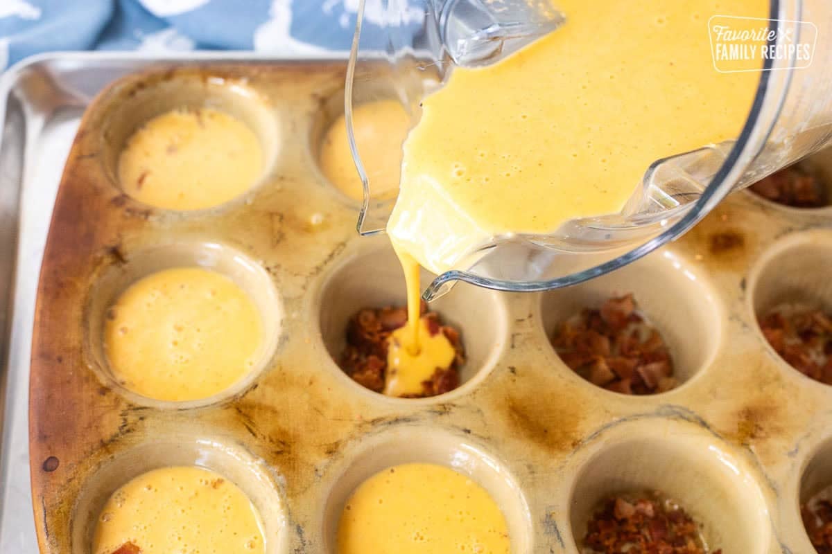 Pouring egg mixture into muffin pan over bacon pieces.