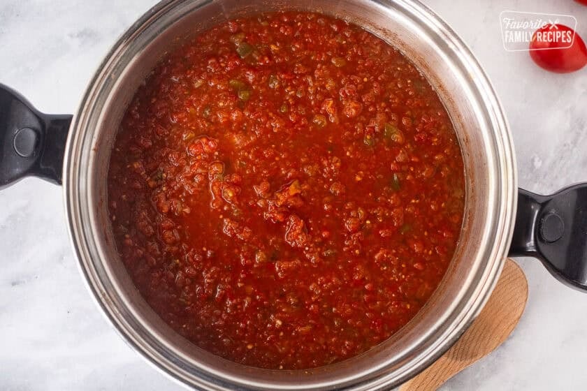 Simmered large pot of sweet canned salsa.
