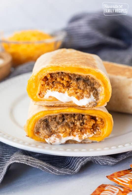 Two halves of a copycat quesarito stacked on top of each other on a plate.
