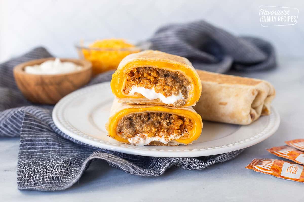Two halves of a copycat quesarito stacked on top of each other on a plate.
