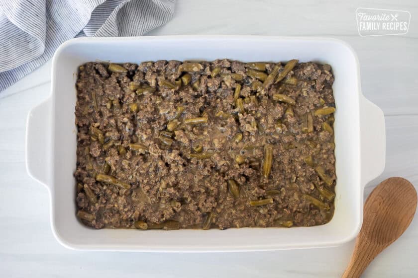 Ground beef and green bean mixture in a casserole dish.