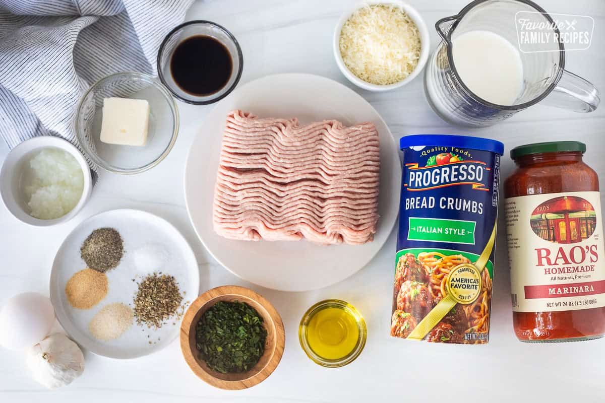 Ingredients to make turkey meatball recipe including ground turkey, Italian style breadcrumbs, marinara sauce, milk, grated Parmesan cheese, olive oil, fresh parsley, Italian seasoning, salt, pepper, garlic powder, onion powder, onion, butter, soy sauce, egg and garlic.