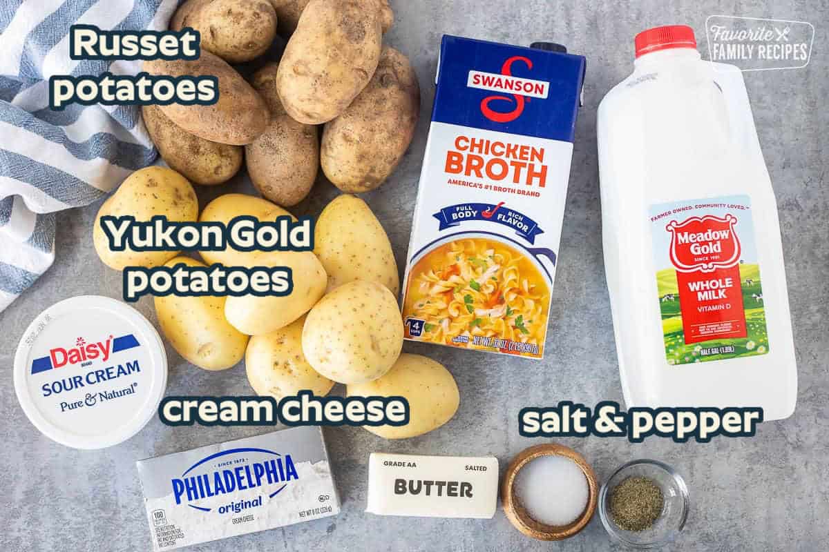 Labeled ingredients for Crockpot Mashed Potatoes: Russet and Yukon Gold potatoes, chicken broth, whole milk, sour cream, cream cheese, butter, salt, and pepper.